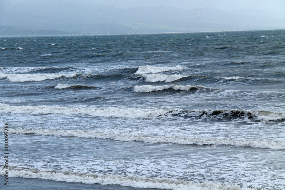Sea Waves Breaking on a Shallow Coastal Beach.