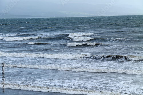 Sea Waves Breaking on a Shallow Coastal Beach.