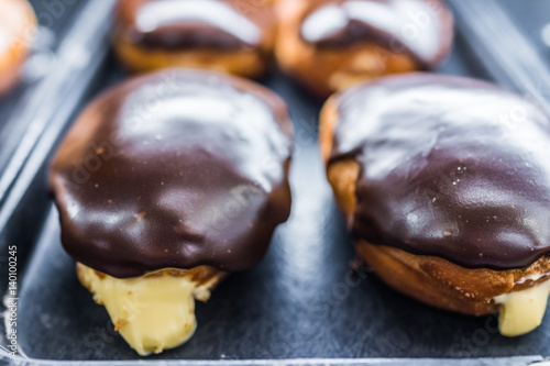 Boston cream donuts with filling oozing out