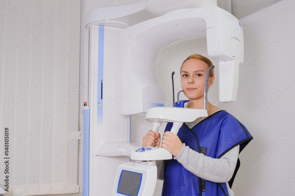 woman patient doing panoramic teeth x-ray woman patient doing panoramic teeth x-ray