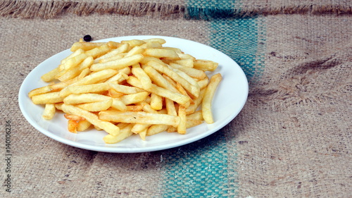 Foto French fries, chips or finger chips are served hot, either soft or crispy, and a