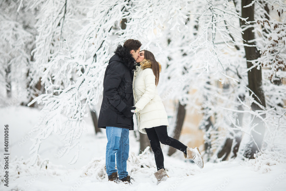 couple lovers kiss winter street forest. Couple love