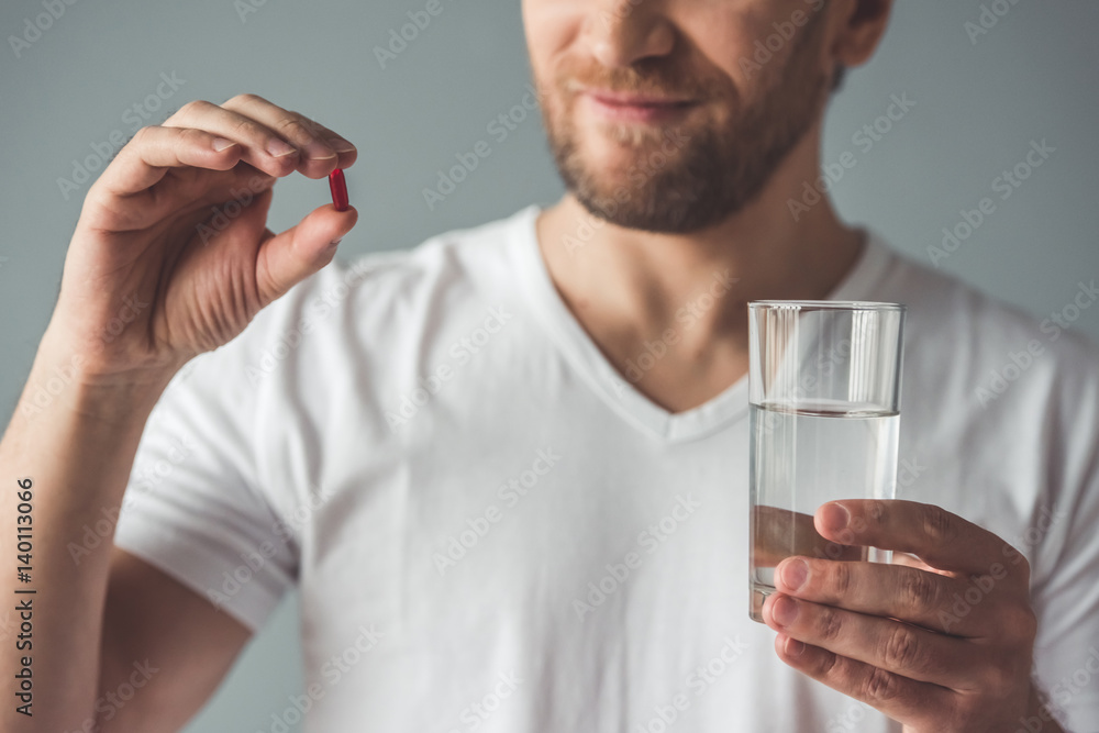 Fototapeta premium Handsome man with medicine