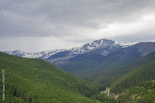 Panorama of Carpathians mountains with stormy clouds sky and snow on the tops,Transylvanian,Romania,Europe