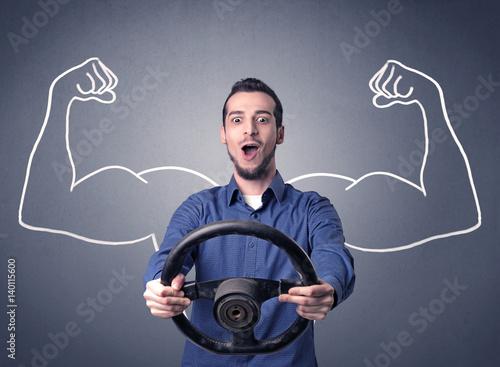 Fotografie Man holding steering wheel