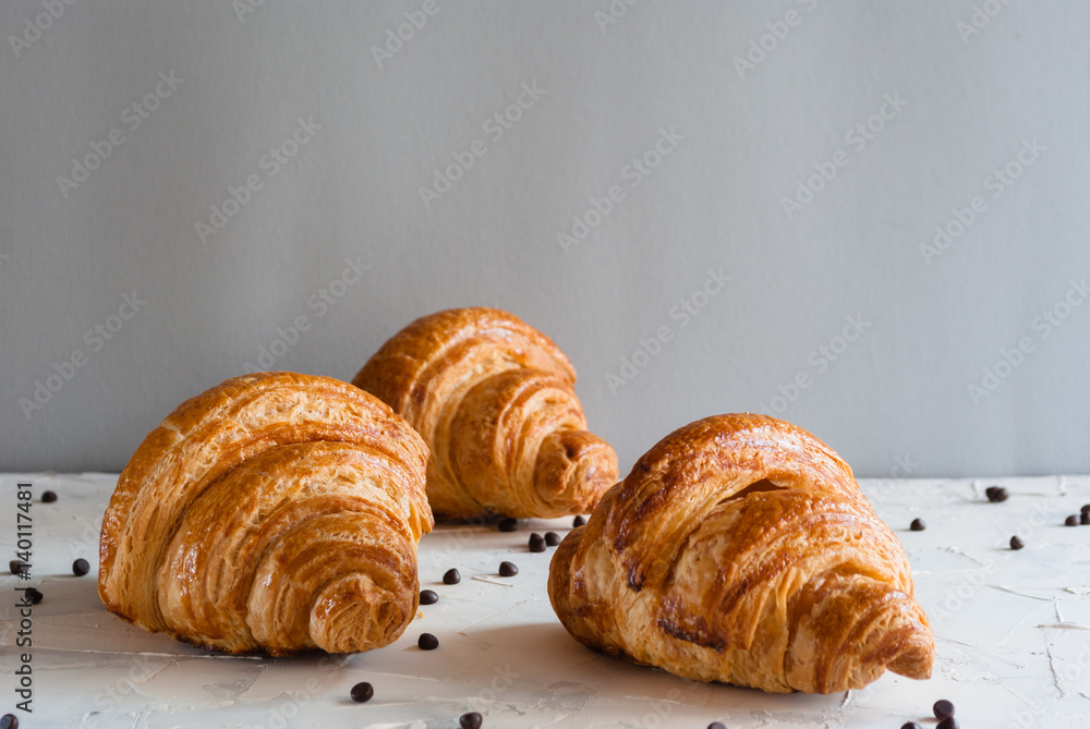 Croissant for breakfast. Chocolate crumbs.