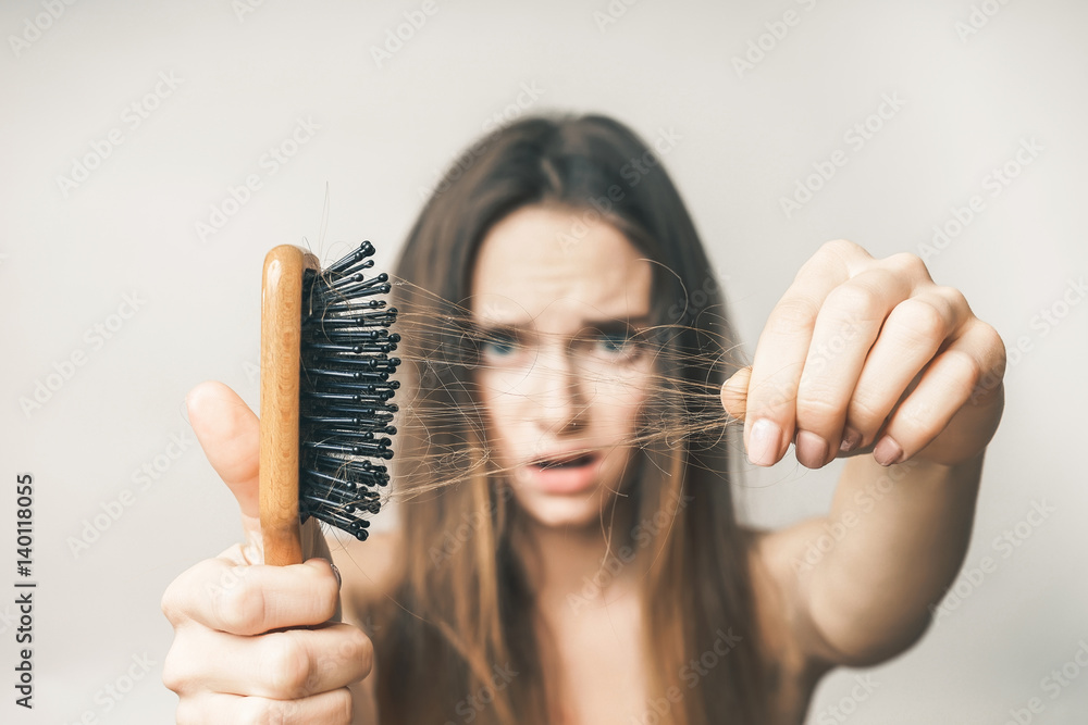Woman with hair comb loss hairs close up - obrazy, fototapety, plakaty 