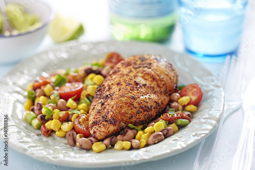 Vászonkép Cajun grilled chicken breast on vegetable salad