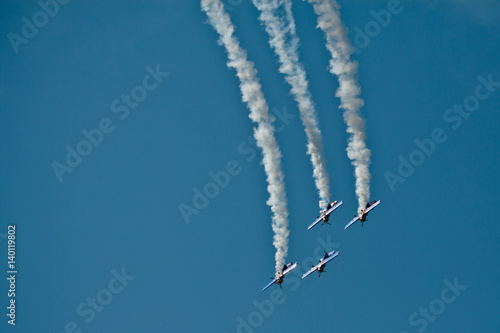 4 planes at airshow. Teamwork. Acrobat.