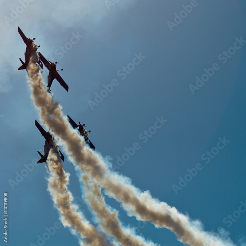 4 planes at airshow. Teamwork. Acrobat.