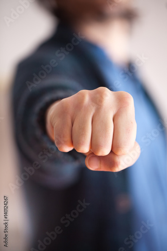 punch close up, caucasian man wearing casual dress