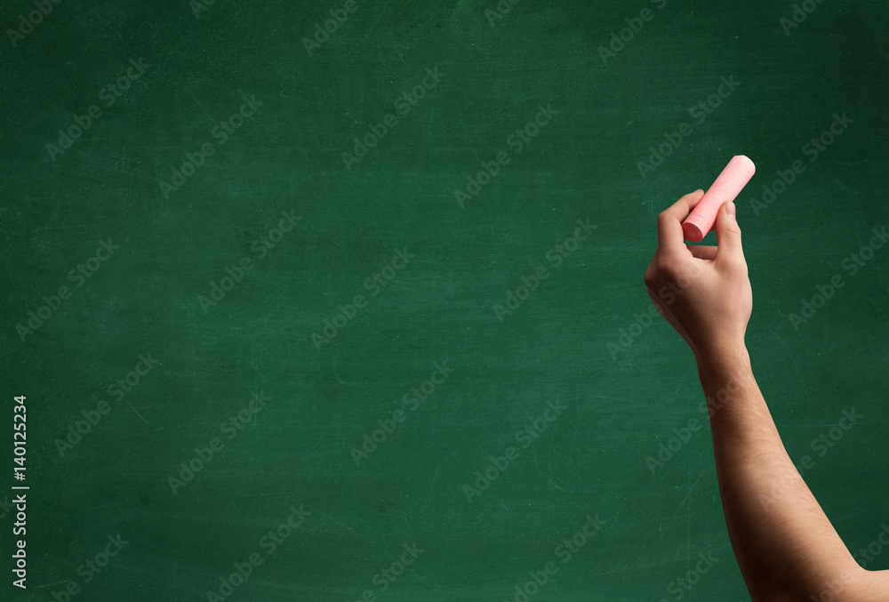 Hand writing on clean blackboard Hand writing on clean blackboard