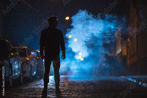 Принти на полотні The man stand on the fume street