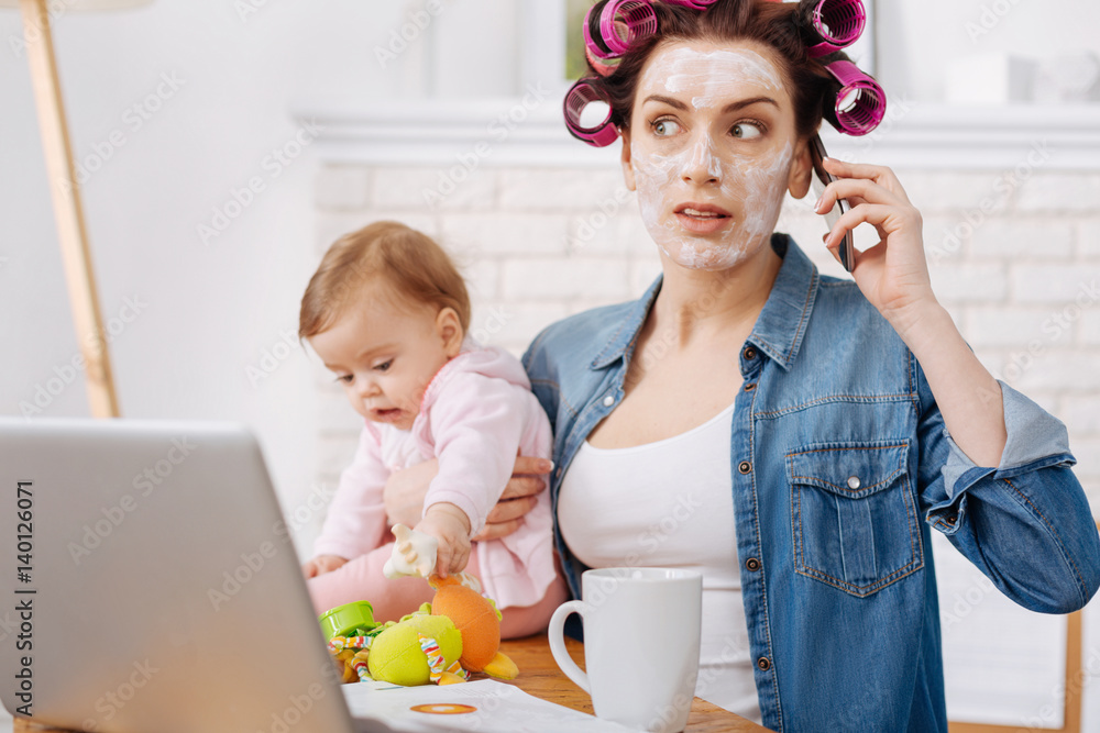 Emotional charismatic young woman looking shocked Emotional charismatic young woman looking shocked