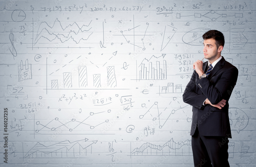 Salesman standing with drawn graph charts Salesman standing with drawn graph charts