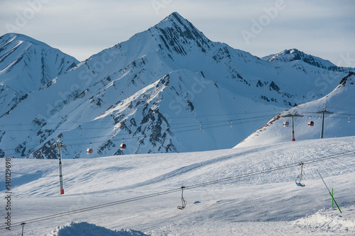 Snowy winter mountains in sun day. Caucasus Mountains, Georgia, from ski resort Gudauri © irimeiff