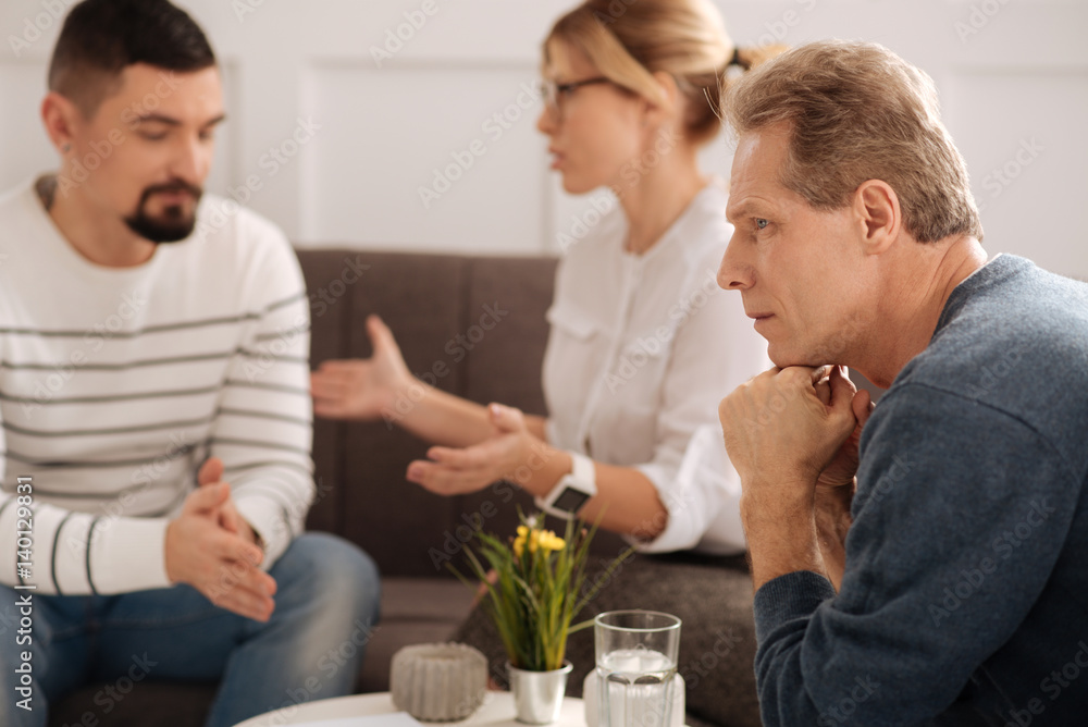 Unhappy gloomy man focusing on his thoughts Unhappy gloomy man focusing on his thoughts
