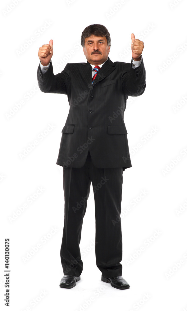 Full length of mature business man with thumbs up