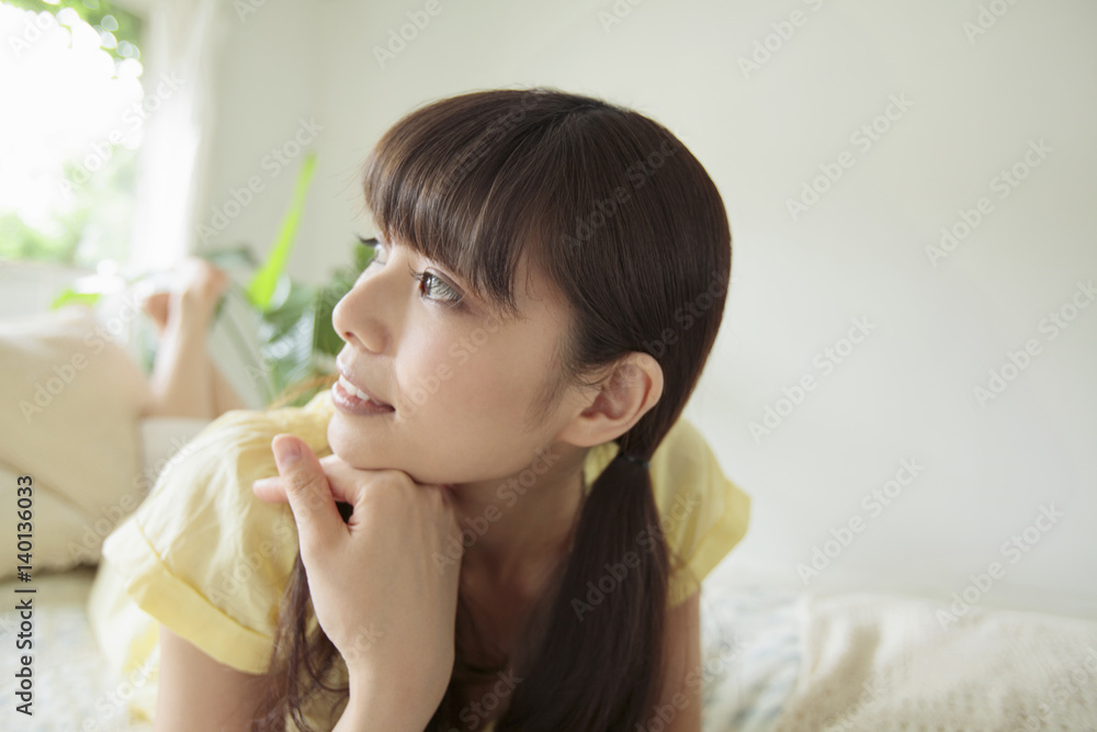 Young Woman Lying on Bed Young Woman Lying on Bed