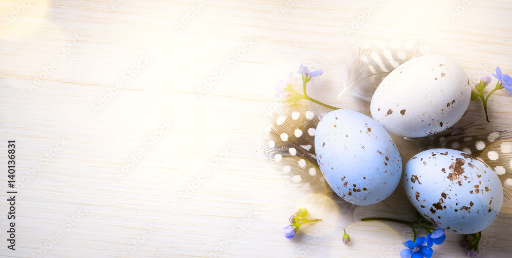 Happy Easter day; Holidays background with Easter eggs and spring flowers on table Happy Easter day; Holidays background with Easter eggs and spring flowers on table