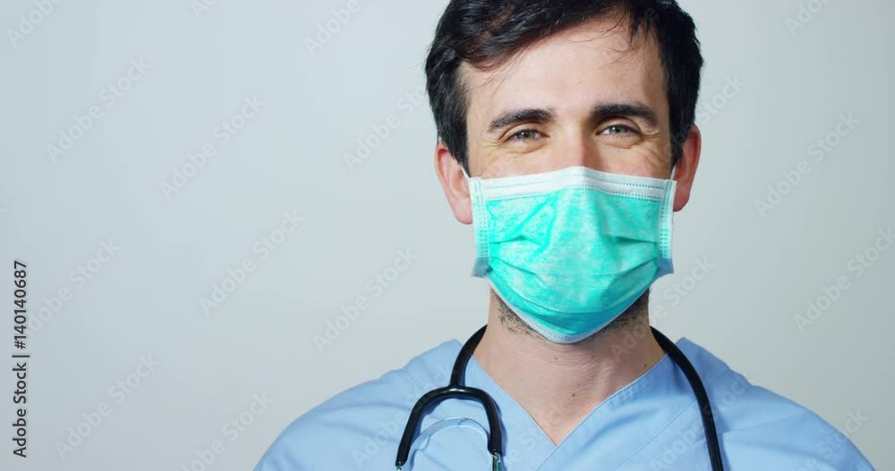 close up portrait of a surgeon or doctor with mask and headset ready for operation in hospital or clinic. The surgeon smiles safe and proud of himself. Concept of medicine, hospitals and doctors, care close up portrait of a surgeon or doctor with mask and headset ready for operation in hospital or clinic. The surgeon smiles safe and proud of himself. Concept of medicine, hospitals and doctors, care