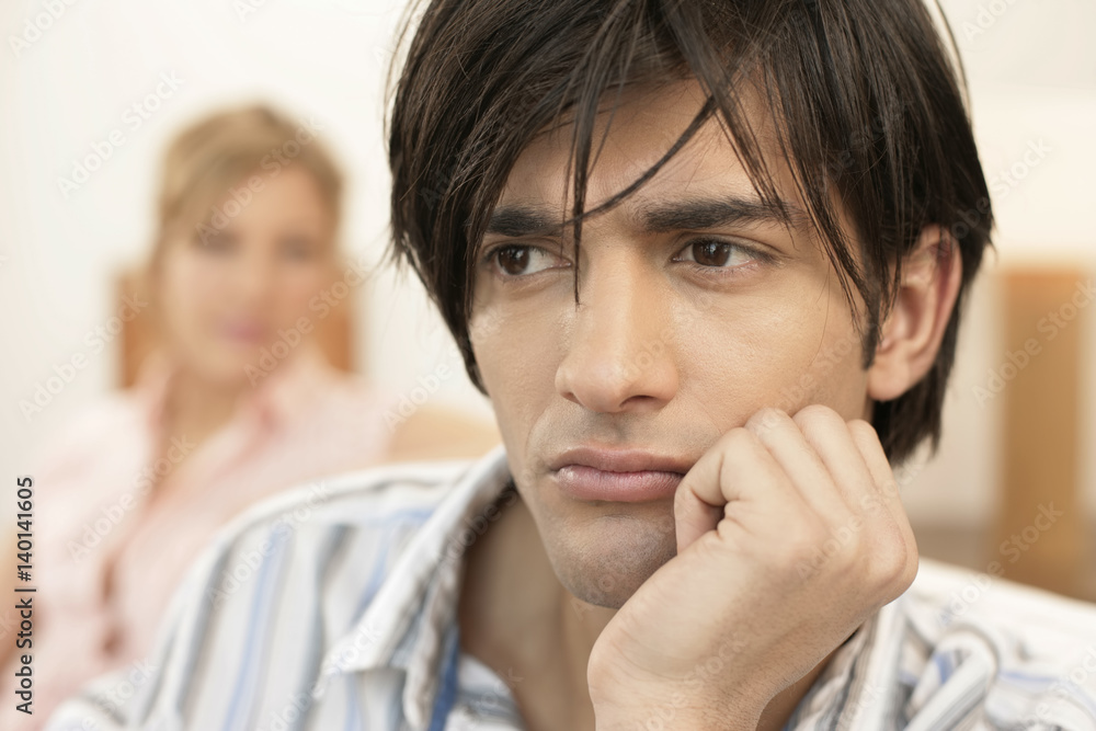 Dissatisfied woman sitting in background Dissatisfied woman sitting in background