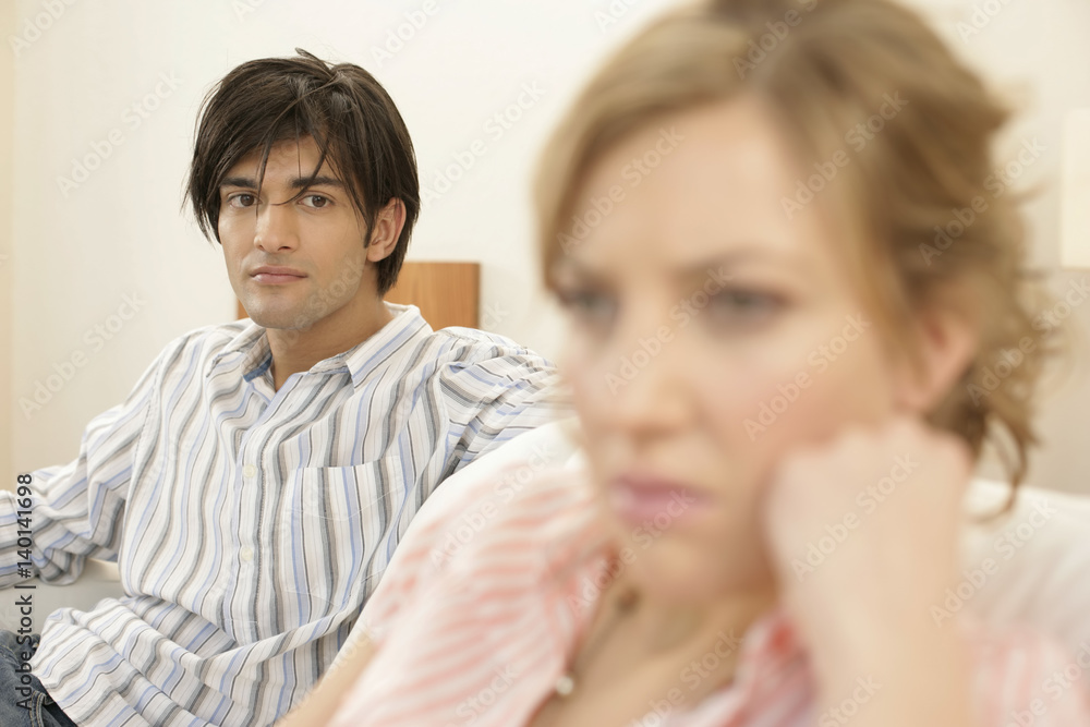 Dissatisfied man sitting in background Dissatisfied man sitting in background