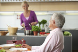 Blonde woman is making dinner for herself and her husband, selective focus