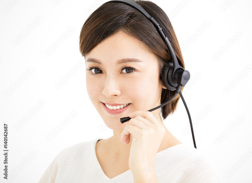 Smiling young business woman with headsets Smiling young business woman with headsets