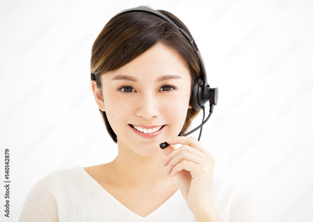 Smiling young business woman with headsets Smiling young business woman with headsets