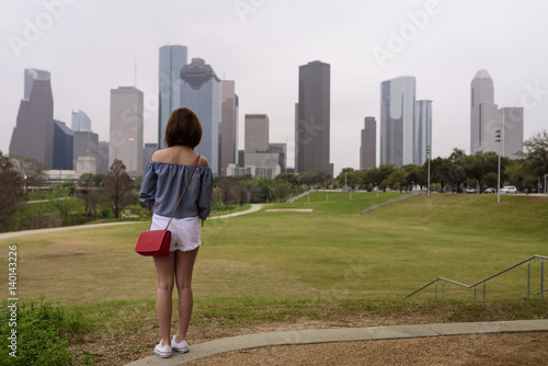 A visitor enjoys a view of downtown Houston in TX USA