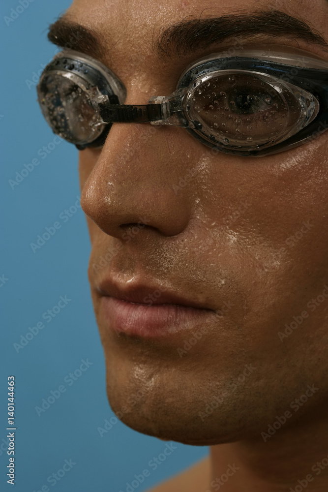 Portrait of a swimmer wearing goggles Portrait of a swimmer wearing goggles