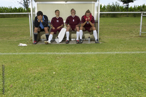 Disappointed kickers sitting on substitutes' bench