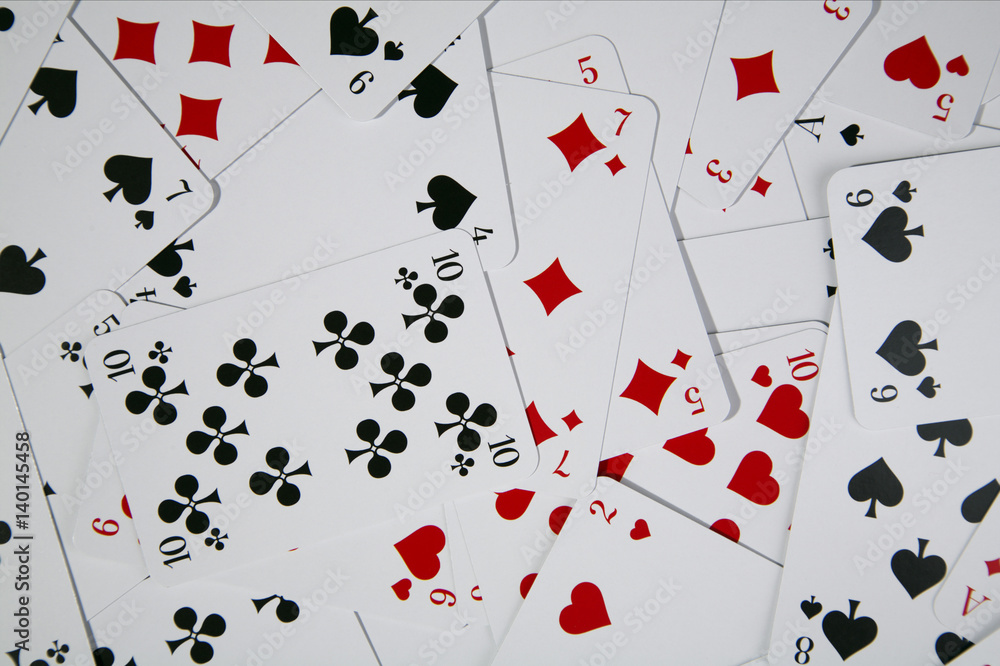 Playing cards mixed together Playing cards mixed together