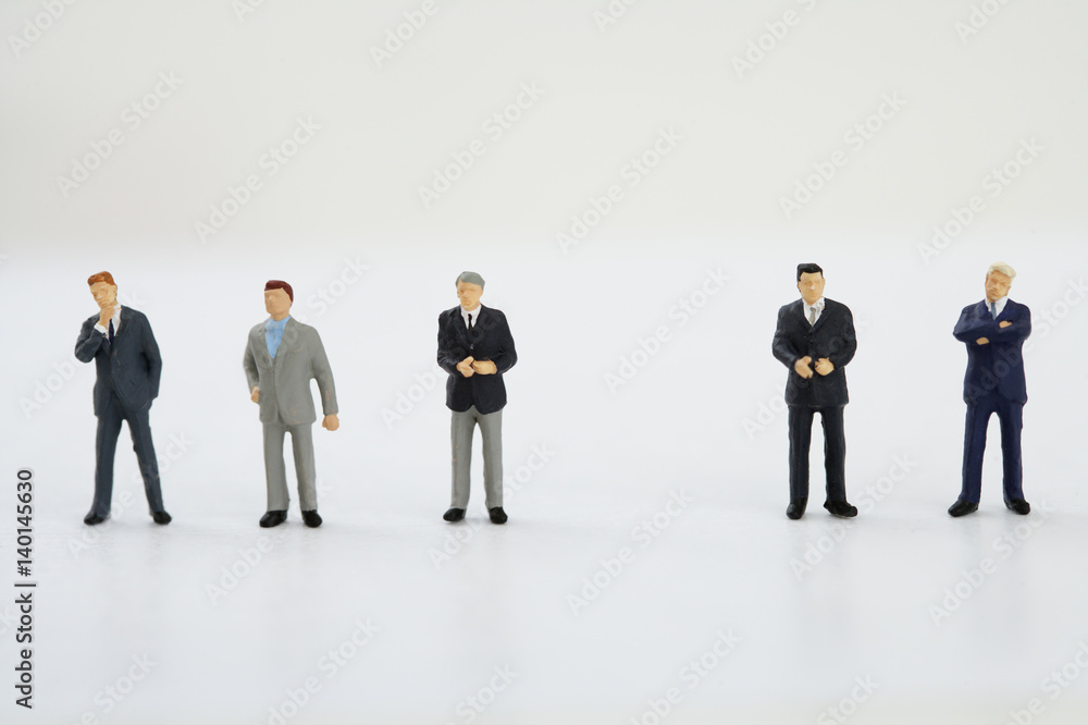 Businessmen figurines standing in a row