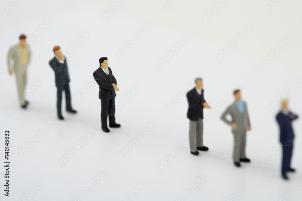 Fototapeta premium Businessmen figurines standing in a row