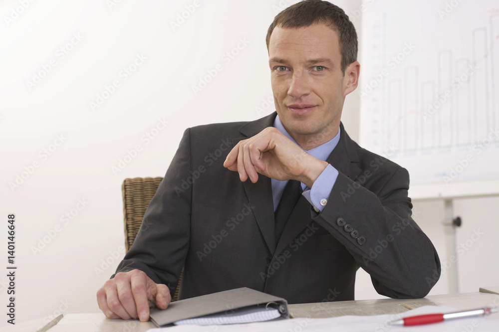 Man sitting on a desk Man sitting on a desk