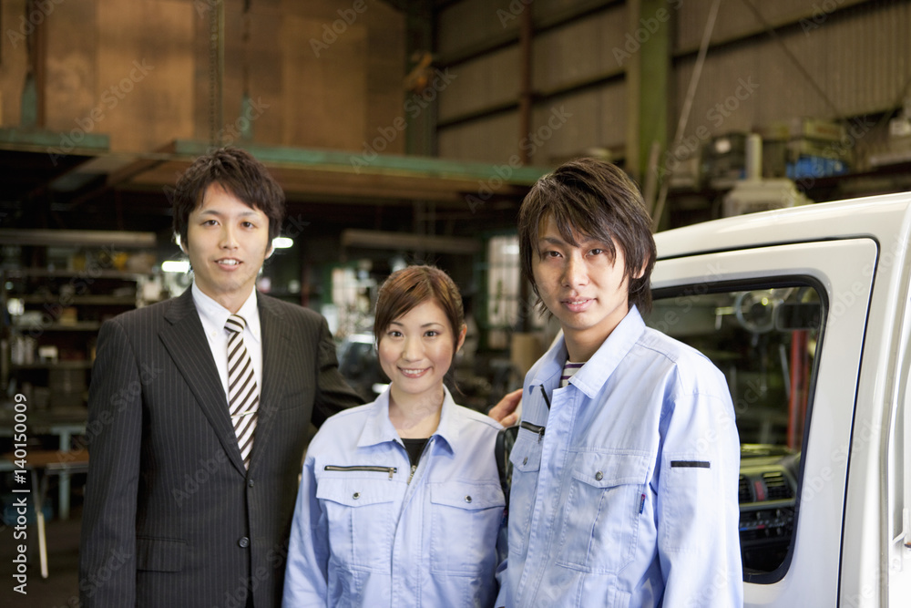 Two Car Mechanics and Businessman Two Car Mechanics and Businessman