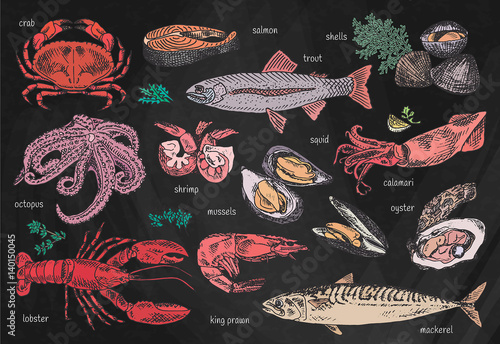 Beautiful seafood set on chalkboard background