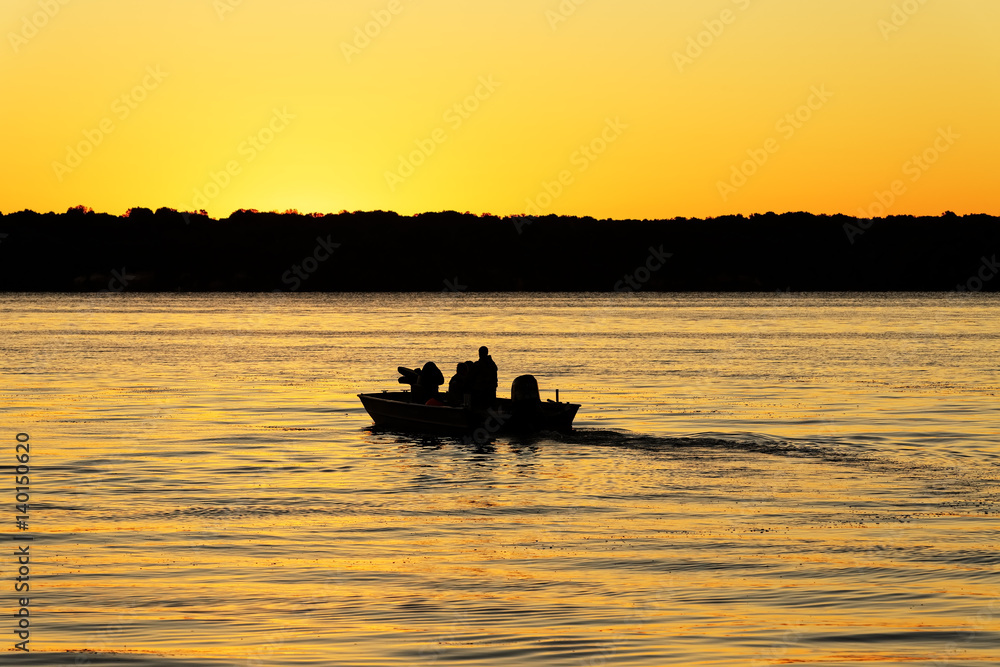Fishermen Boating into a Golden Sunrise