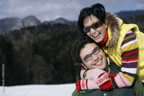 Young couple embracing each other, laughing