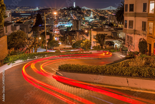 Crookedest Street at Night - A night panoramic overview of Lombard Street, the steepest and crookedest street, and city neighborhoods in Russian Hill and Telegraph Hill areas, San Francisco, USA. photo