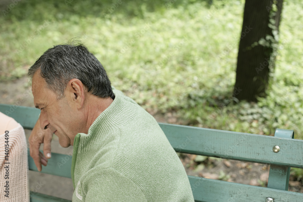 Mature man sitting on a bench Mature man sitting on a bench
