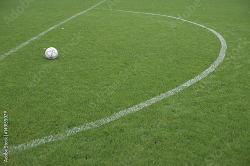 Football lying in a marked area, ready for direct free kick photo