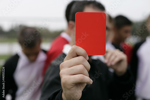 Referee showing the red card