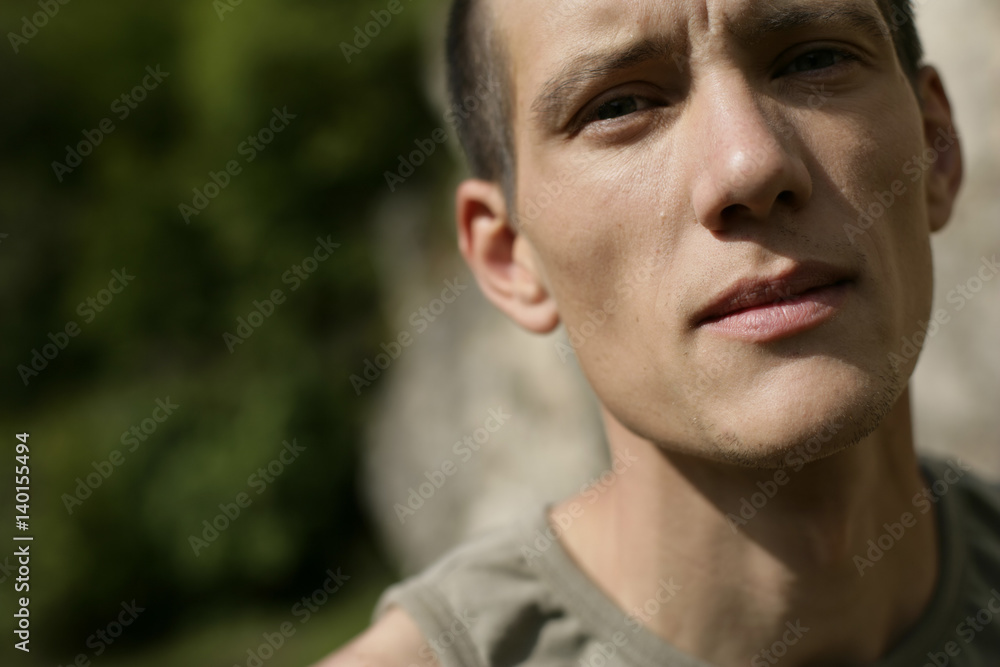 Young man is looking exhausted (part of), close-up Young man is looking exhausted (part of), close-up