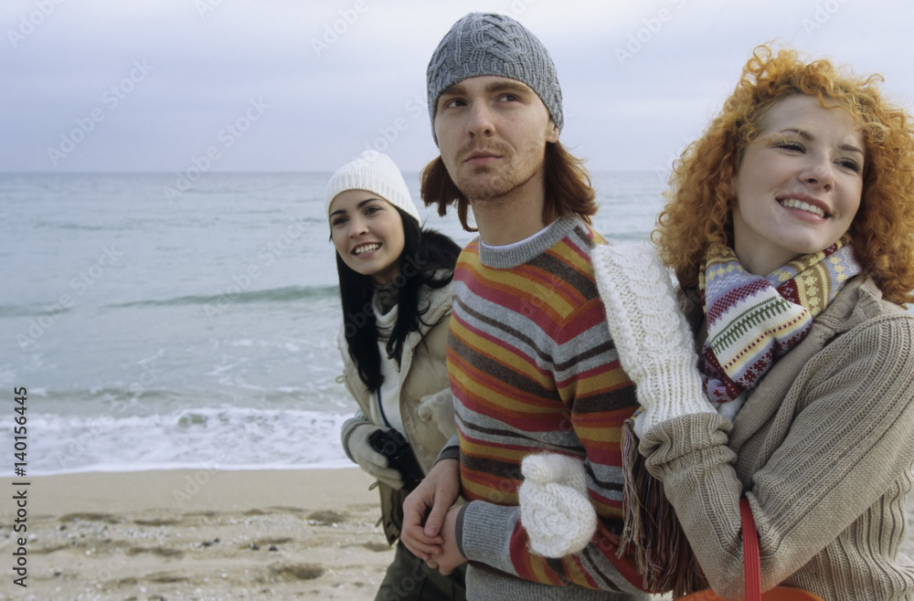Three Friends strolling along the Beach Arm in Arm - Fun - Together - Trip Three Friends strolling along the Beach Arm in Arm - Fun - Together - Trip