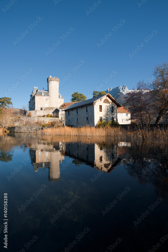 Reflected Lakeside Castle on Lake Annecy in French Alps in Duingt, France. Vertical