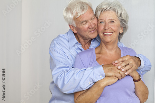 Happy senior couple hugging