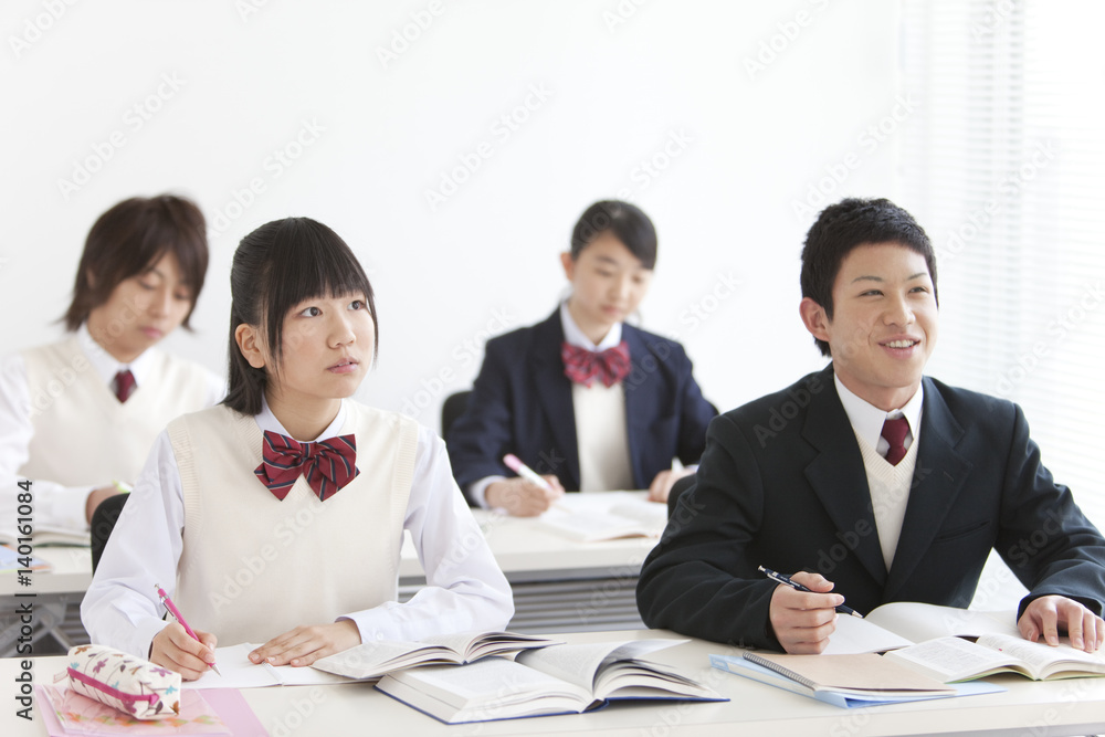 Four High School Students in Classroom Four High School Students in Classroom
